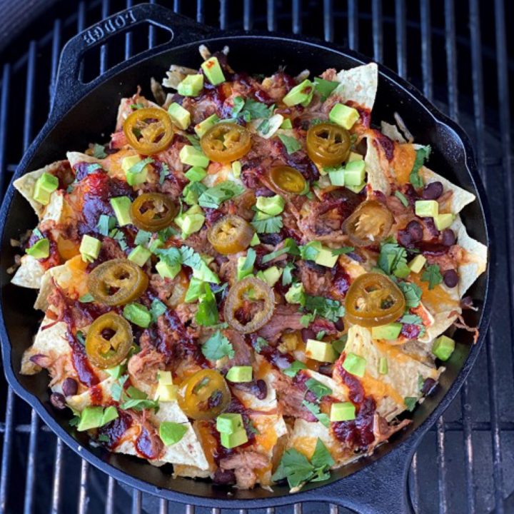 Pulled pork nachos finished and on the grill. How many are you eating?