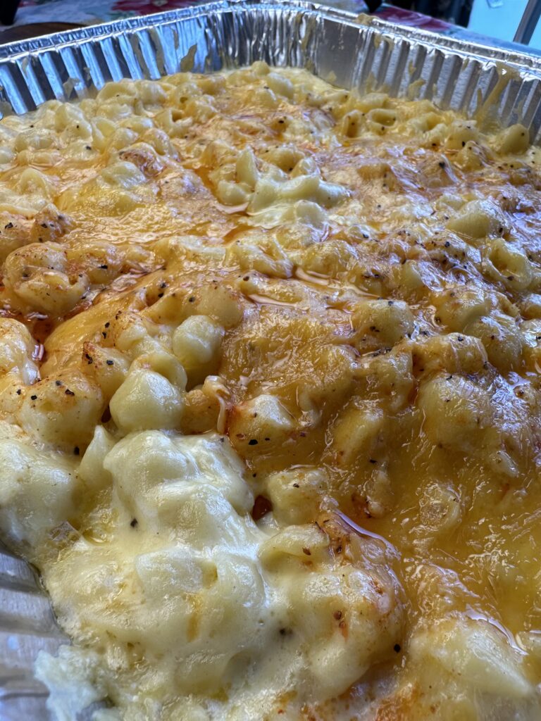 Pan of macaroni and cheese after being on the grill. 
