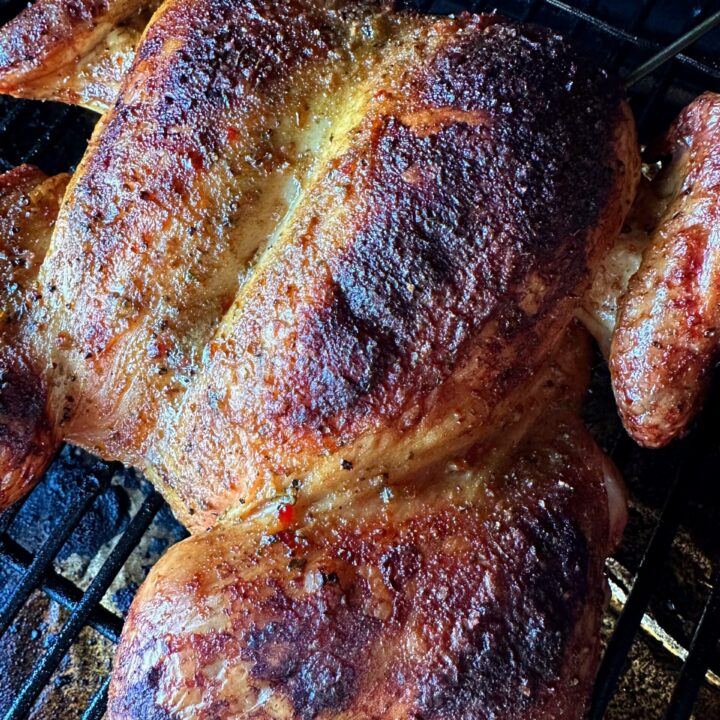 Smoked spatchcock chicken on the grill.