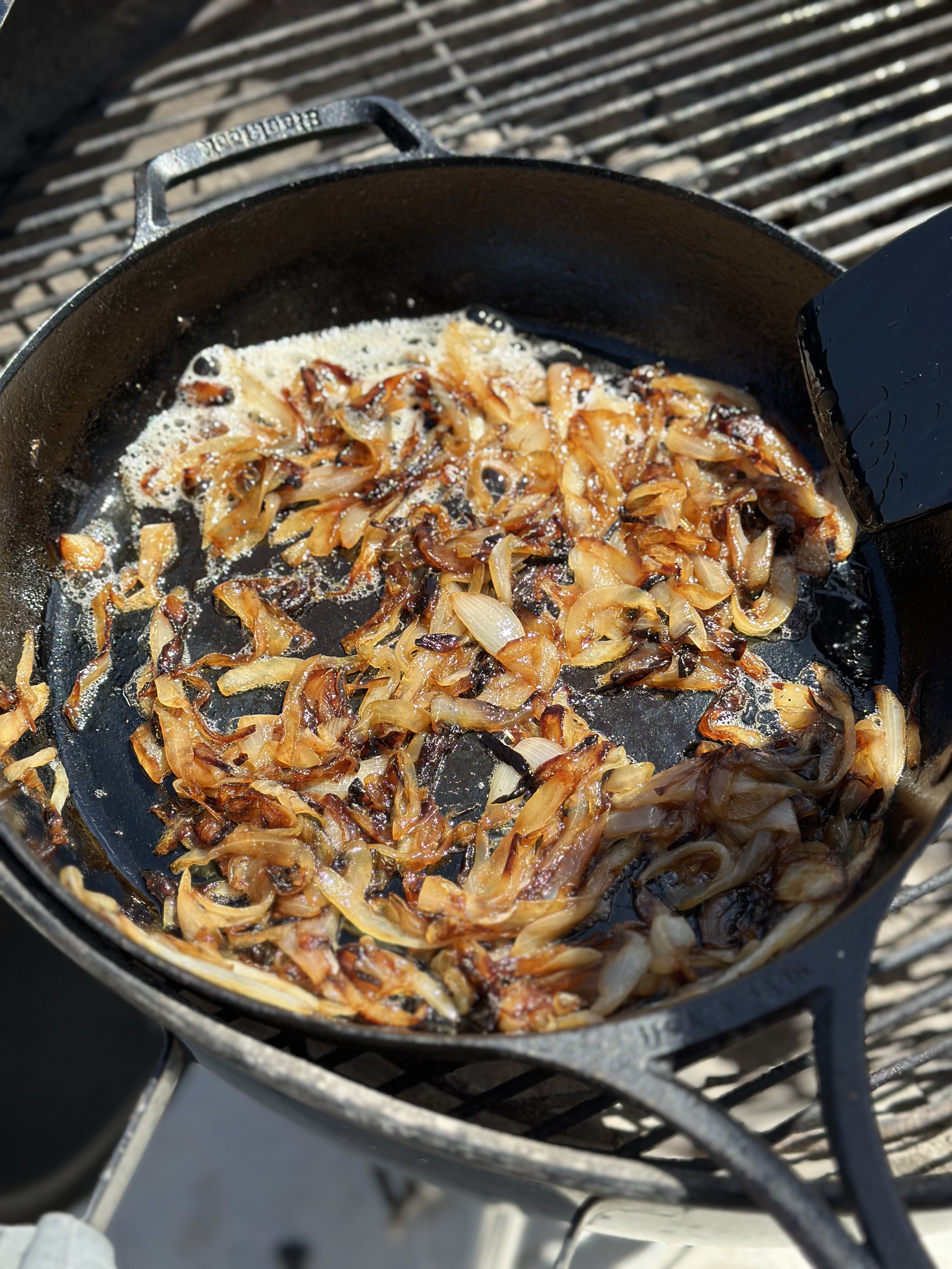 Slow cooked onions in a skillet makes it caramelize. 