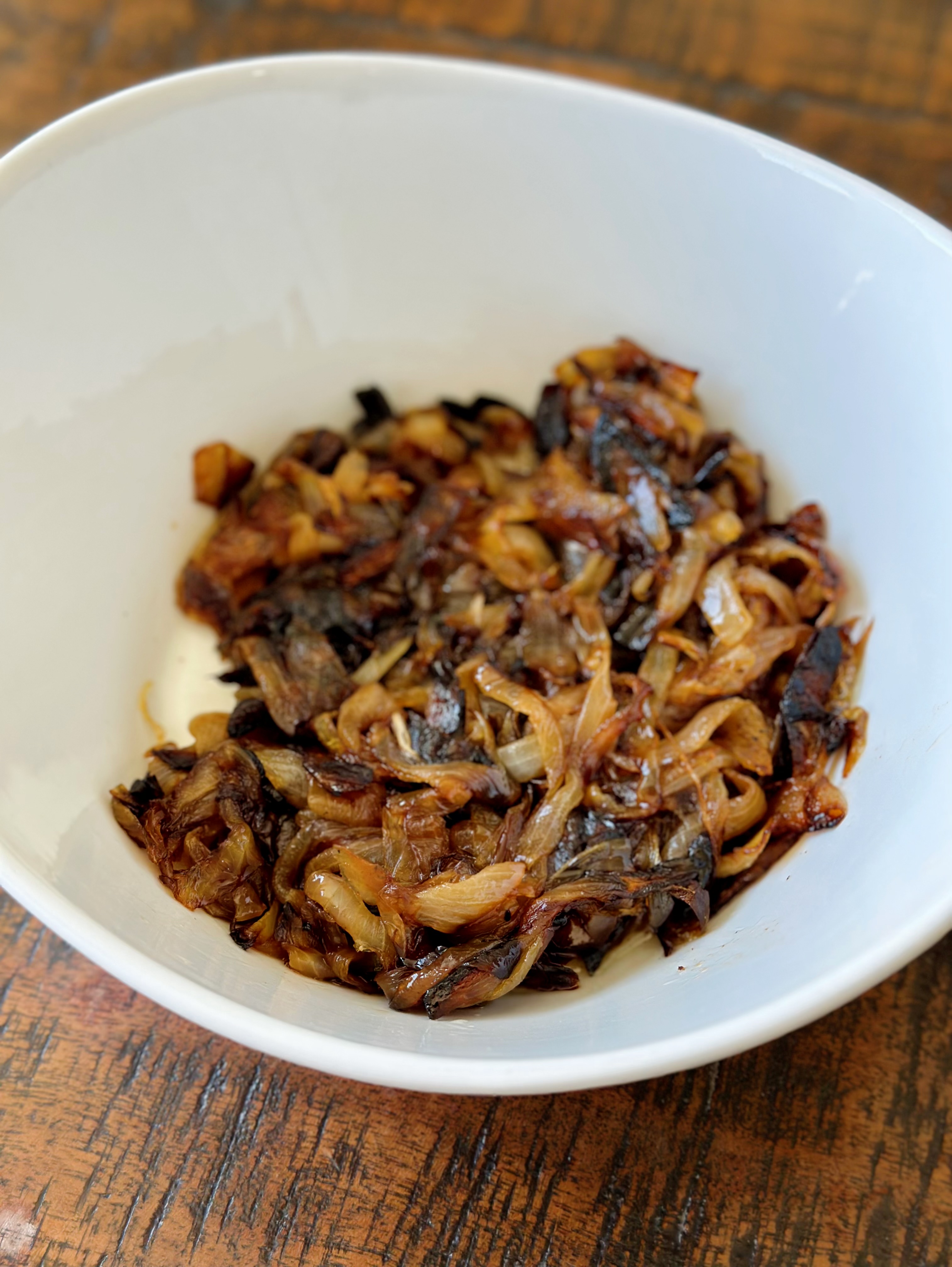 Bowl with two caramelized onions   
